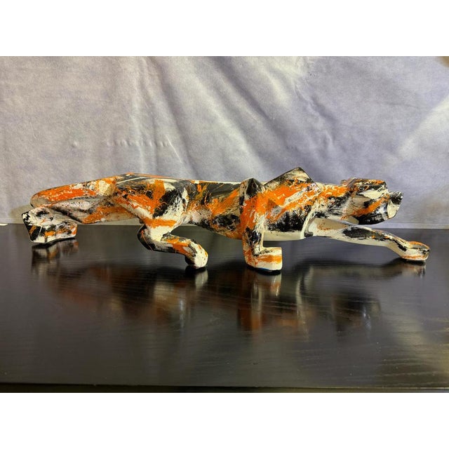 Resin panther painted by artist Silvio Formichetti in the colors of orange, white and black. This piece has an attribution...