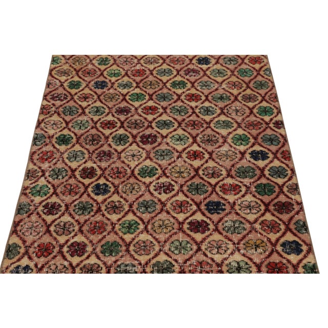 This vintage runner rug is a 3x9 Turkish distressed piece, made with hand-knotted wool circa mid-20th century. It is an...
