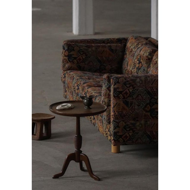 This refined side table is a classic example of Danish Mid-Century Modern design from the 1960s by Anton Kildeberg for...