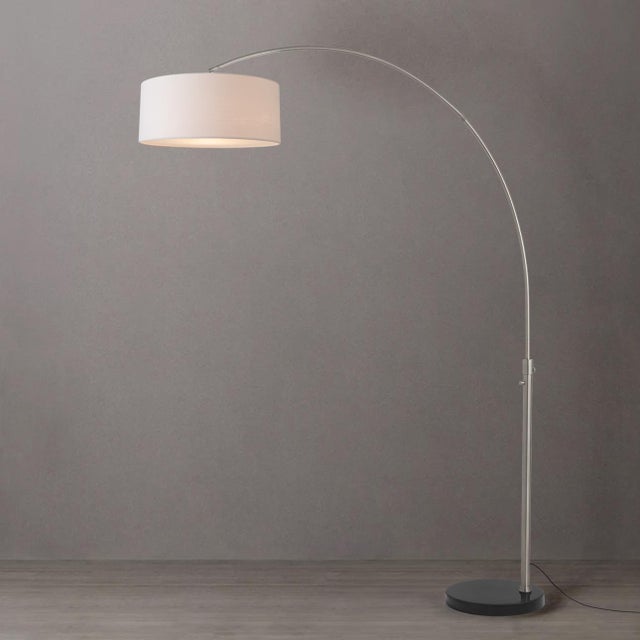 The Float Arc Lamp is a Modern arc lamp with a satin nickel steel frame, designed by Peter Morelli in 1960. This iconic...