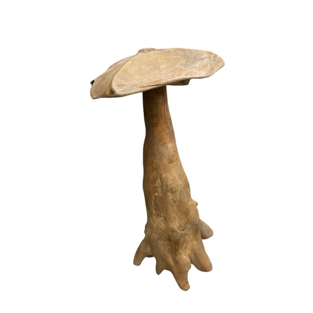 Capturing the organic beauty of the natural world, this vintage hand-carved garden sculpture is fashioned from a single...