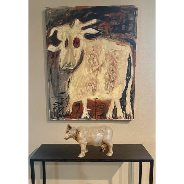 Perfect for cow lovers or the country house. Standing proudly at 9” high X 15” long this cow sculpture is made of a...