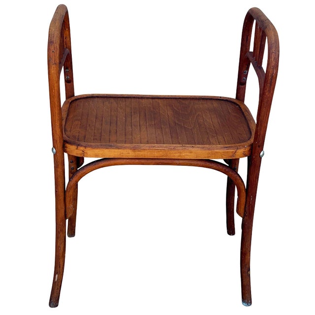 This rare late 19th-century bentwood bench with side arms crafted by Fischel in Czechoslovakia, Retaining its original...
