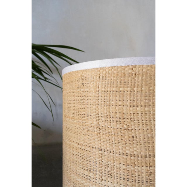 Ceramic Table Lamp with Raffia Lampshade White glazed ceramic base with an octagonal section, complete with a circular...