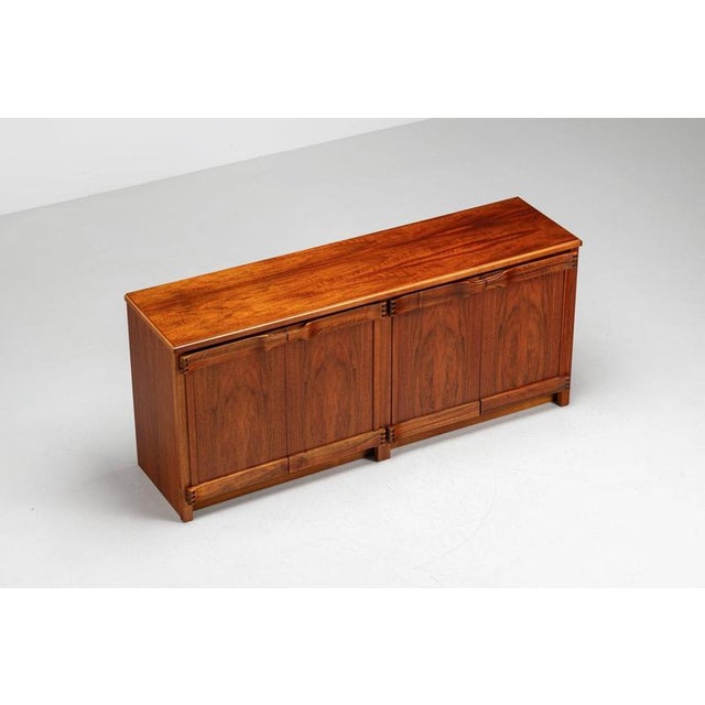 A distinctive walnut sideboard designed by Franz Xaver and produced by Sproll in Switzerland during the 1960s. Crafted in...