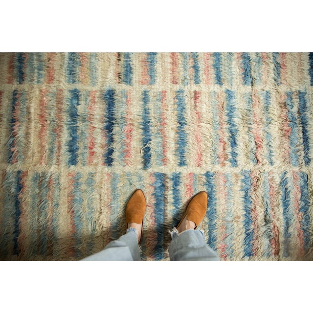 :: Inspired in part by Moroccan carpets of long shaggy pile with an abstract modern design of multiple columns bearing...