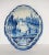 Two antique Dutch Royal Makkum Delft blue and white plaques. Image is of a fishing boat in the canal and two men fishing...