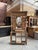 This oak entryway coat rack has been fully restored. It comprises a hat rack, six hooks, a large oval beveled mirror, a...