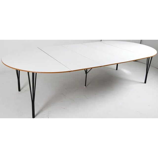 Danish modern design at it's best with a table based on the original design produced by the collarboration of Piet Hein,...