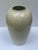Tall high gloss creamy champagne colored urn shape vase. Fill with silk or fresh flowers or branches and place on a center...