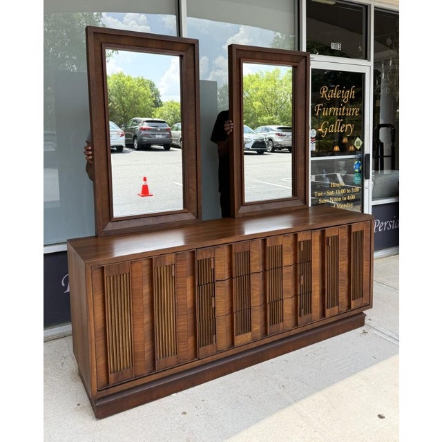 This 1970s Brutalist-inspired dresser, crafted in Canada, features a bold architectural façade with deeply textured ribbed...