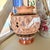 Add a touch of Aegean charm to your shelf with this striking hand-painted terracotta vase from the renowned Giannis studio...