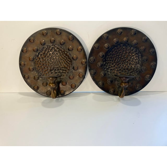 This pair of sconces are in the Arts &Crafts style The designs are hand crafted The finish is a rich bronze color...