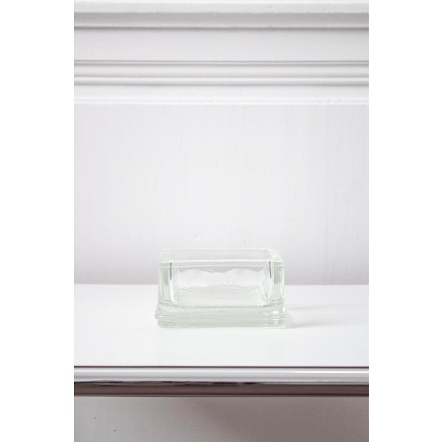 A stunning glass trinket tray designed by Le Corbusier and Charlotte Perriand, produced by Lumax. An authentic piece of...