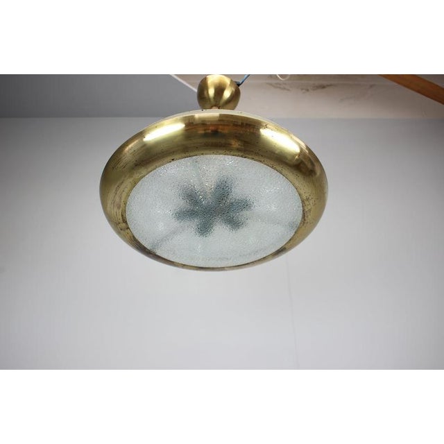 Rare original ufo pendant lamp designed by josef hůrka for napako in czechoslovakia, dating from the 1930s. The lamp...