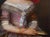 Dark red-toned realist portrait of a Victorian Lady. The painting depicts a middle-aged lady seated against a dark red...