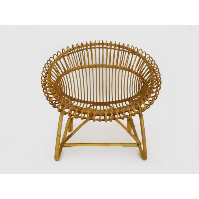 Magnificent vintage rattan armchair from the 60s Rattan armchair from the 60s. Sublime model, in the style of Janine...