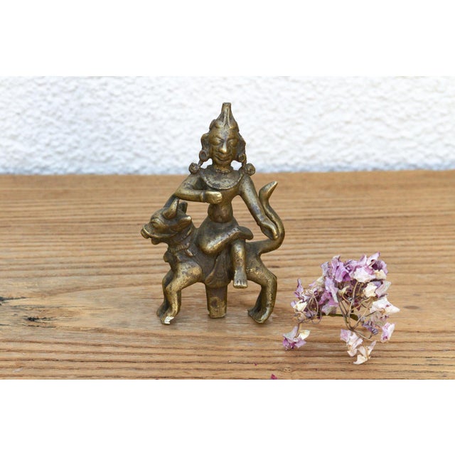 Hand-cast via ancient lost-wax techniques, this rare miniature masterpiece beautifully captures the rustic energy of...