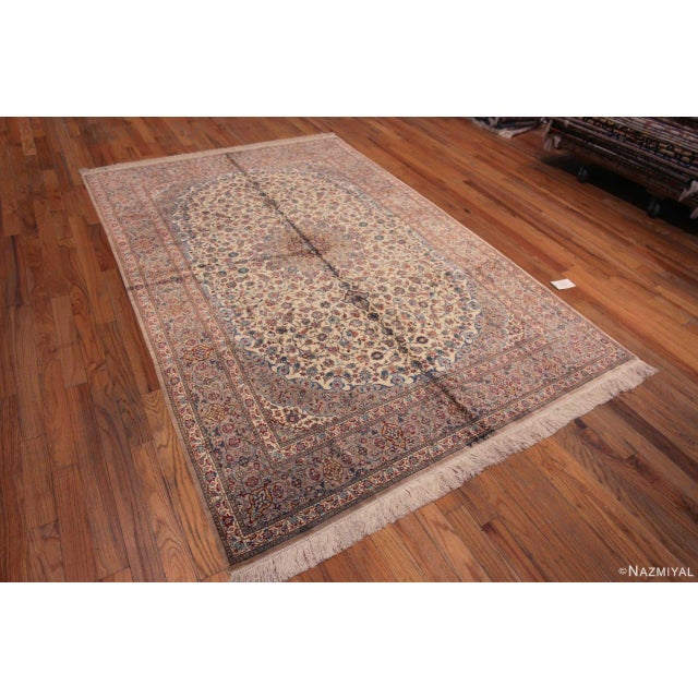 Fine Weave Ivory Background Floral Medallion Design Luxurious Vintage Qum Silk Persian Rug, country of origin: Persian...