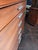 A rare Paul McCobb 6 Drawer Tallboy Dresser. Walnut With Aircraft Aluminum Trim and handles.