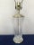 Big and gorgeous Hollywood Regency “draped” crystal lamp adorned with silvery brass. Movie style glam. Looks good in...