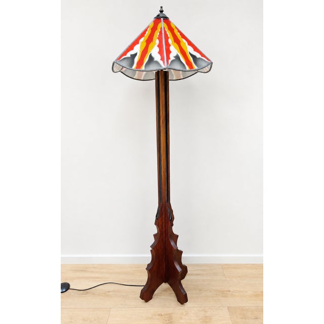 DESCRIPTION: An elegant Amsterdam School floor lamp with a stained glass shade. The shade features a beautiful geometric...