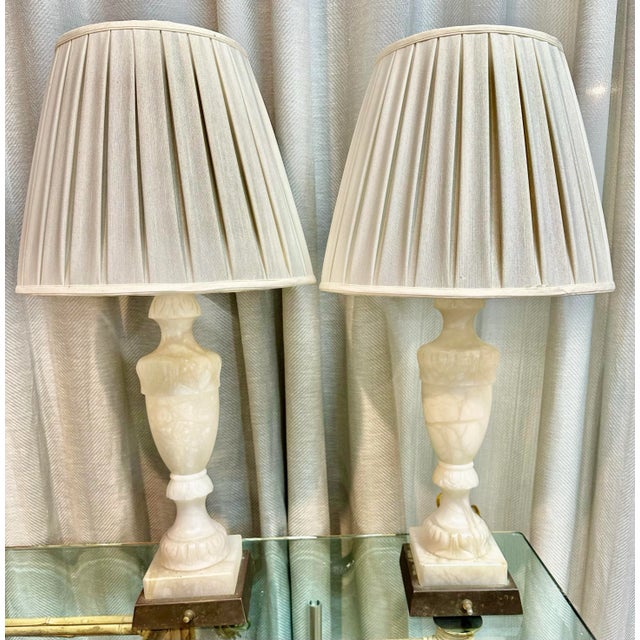 Pair of antique very chic Italian hand-carved white Alabaster table lamps. Lamps are in working condition. Handmade cotton...