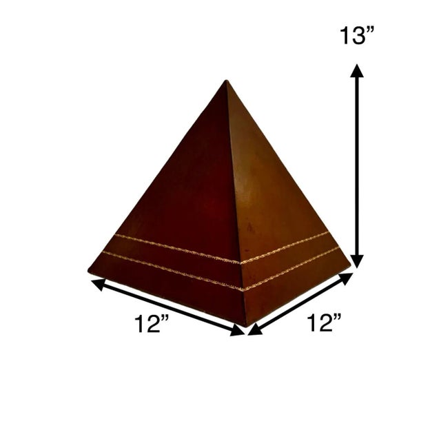 Add a touch of elegance to your office or home decor with this vintage Pyramid Figure Leather Statue. Crafted with high-...