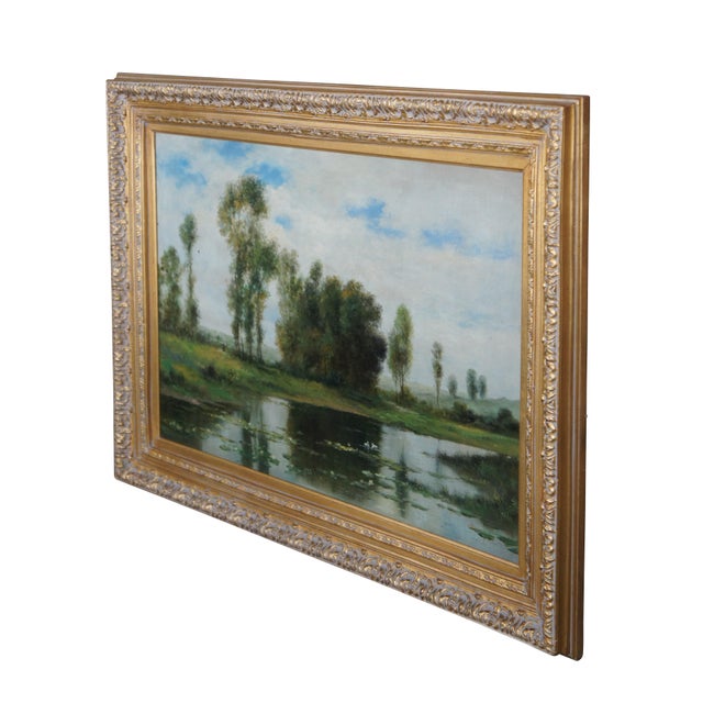 A beautiful 20th century oil painting on canvas, signed lower right. Features a landscape with pond and water lillies....