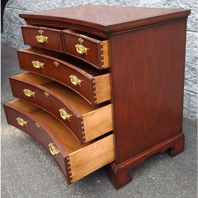 A Federal Style Recessed Front Mahogany Chest of Drawers. Features 3 full drawers and two half drawers, all dovetail built...