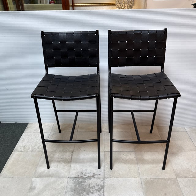 Design Plus Gallery presents a Pair of Woven Leather Counter Stools by Mermelada Estudio for CB2. The stools offer a laid-...