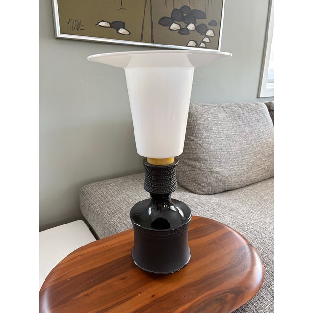 Rarely seen black porcelain table lamp designed by Tapio Wirkkala for Rosenthal. Matte and gloss black porcelain with a...