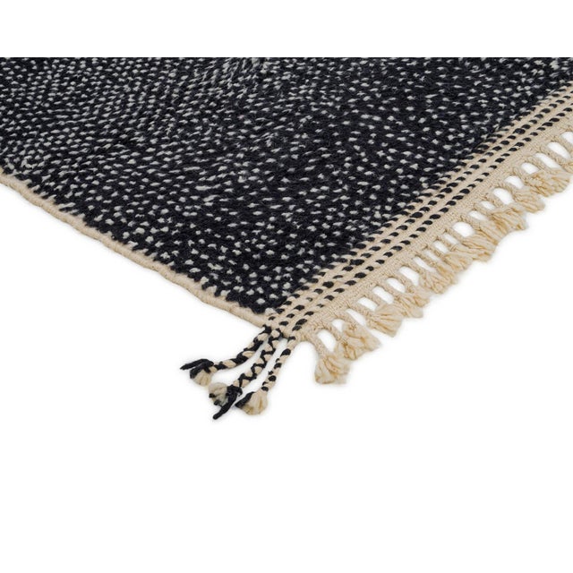 Elegant hand-knotted wool runner, showcasing a dual-tone design with a striking contrast between Jet Black and Natural...