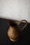 with its graceful silhouette and rich timeworn patina, this antique copper jug is a refined decorative object that...
