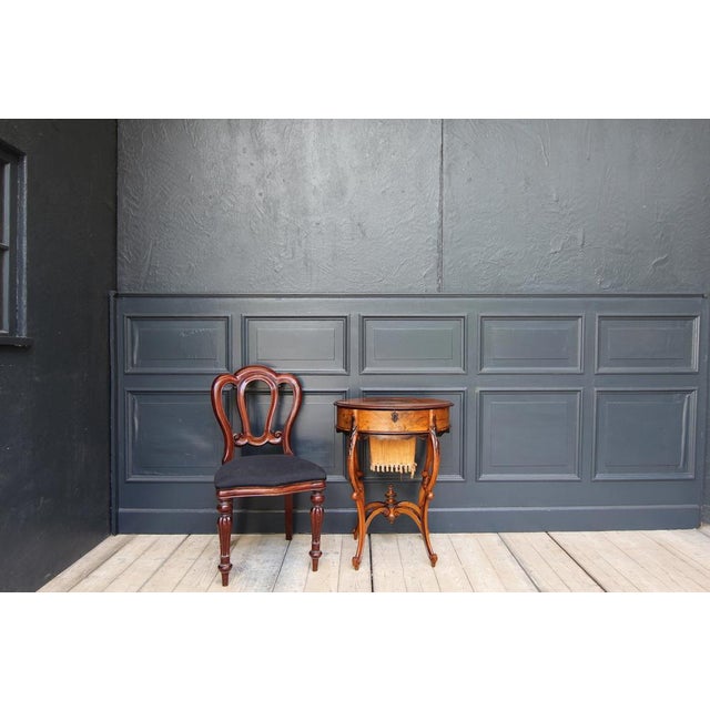 Wiener Baroque sewing table, around 1860. Nussbaum solid and veneered, as well as other different noble woods. Cross oval...