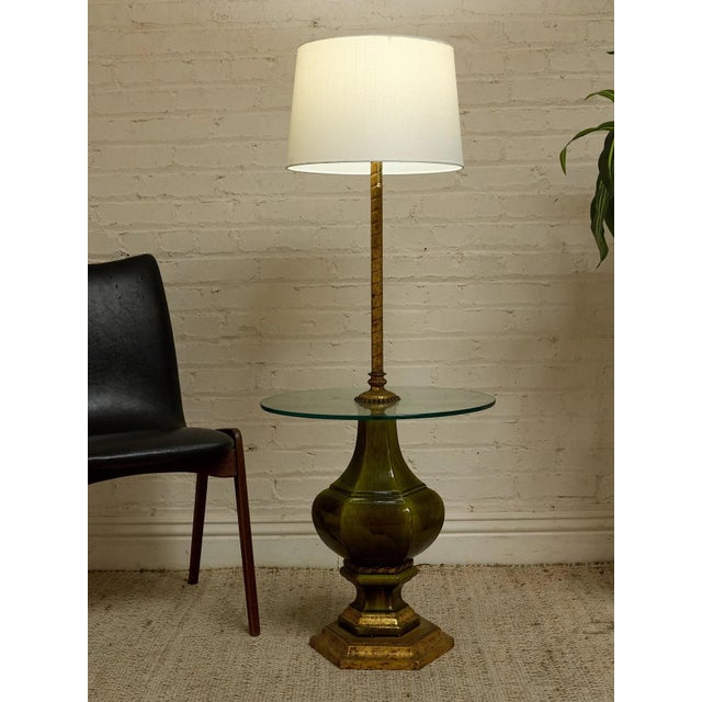 A wonderfully unusual vintage floor lamp combining lighting and furniture in one sculptural piece. The tall slender stem...
