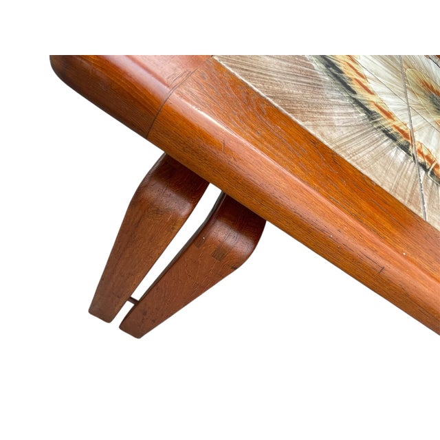 A fine example ! Artist signed MK tile top in good color on well designed double leg with dovetail constructed teak base....