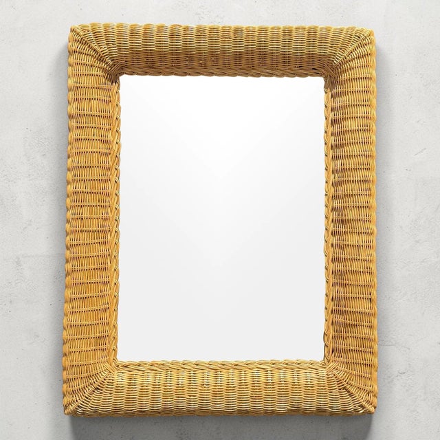 Beautiful vintage wall mirror with a hand-woven coastal wicker frame. This piece is the perfect size for most walls,...