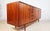 This Ib Køfod-Larsen sideboard is a standout example of Scandinavian modern design produced in collaboration with the...