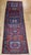 "This striking vintage runner from Northwest Persia features a bold geometric medallion pattern inspired by the region's...