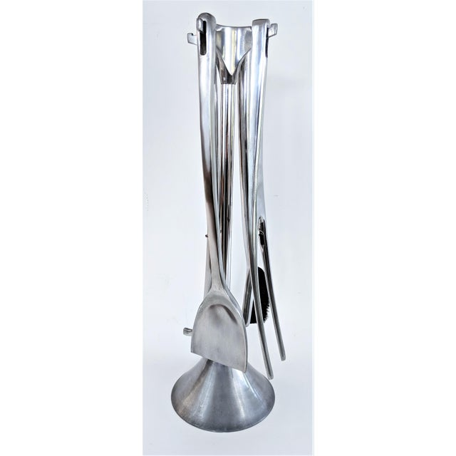 A sculptural “Fuego” fireplace tool set by Umbra, made in Italy circa the 1980s. Executed in cast aluminum, the set...