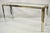 Vintage Romeo Rega Modernist Maison Jansen Style Chrome Brass Glass Console Hall Table. Item features a sleek chrome...