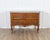 An elegant Louis XV period chest of drawers from the 18th century, crafted in solid walnut and distinguished by its...
