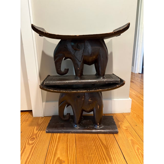 Gorgeous pair of solid wood hand carved elephant Ashanti stools in ebonized wood. Solid and heavy. One stool slightly...