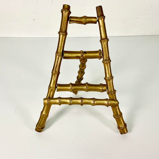 We love to curate bamboo table top easels. This one is special. It’s real bamboo that’s been painted an old gold. It’s a...