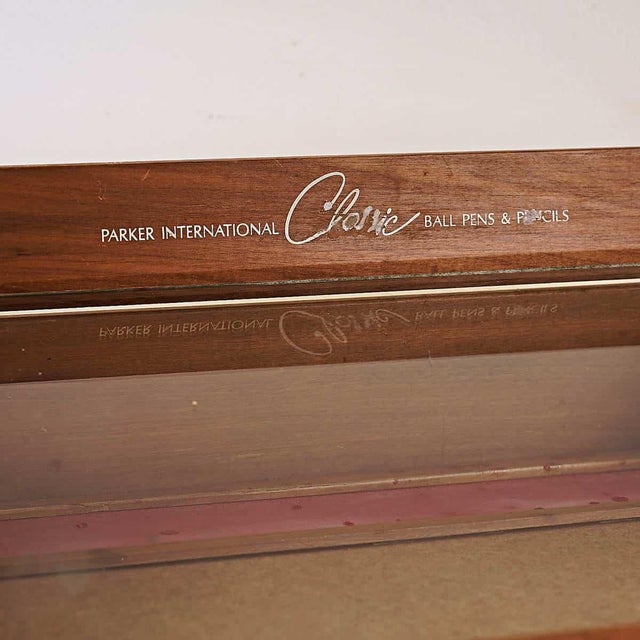 wooden display cabinet with lockable door, parker international Height: 20 Width: 41 Depth: 31 This piece is attributed to...