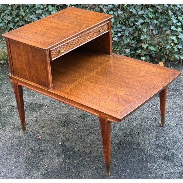 Stunning vintage Imperial Furniture step-end table featuring gorgeous wood grain, a rich warm finish, and a unique two-...