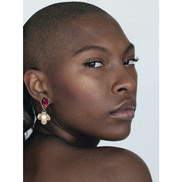 With playful colors, pearls, and hand-carved flowers these are super lightweight and can be worn day to night. Materials:...