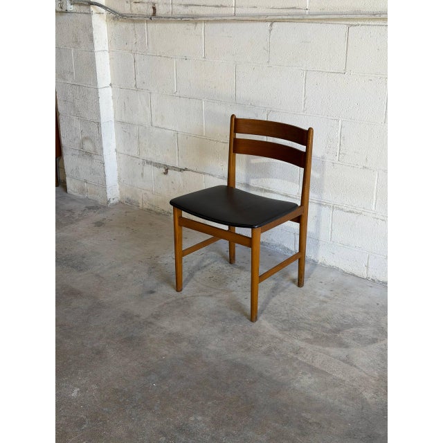 Beautiful vintage Danish modern dining chair crafted in teak with clean Scandinavian lines and elegant minimalist...