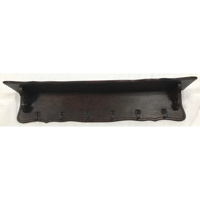 Love this dark wood, simple design with a rustic country feel coat rack. Originally these were used to hang copper pots in...